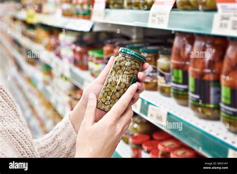 Buyer Hands With A Can Of Canned Capers In The Store Stock Photo Alamy Buyer Hands With A Can Of Canned Capers In The Store Stock Photo Alamy