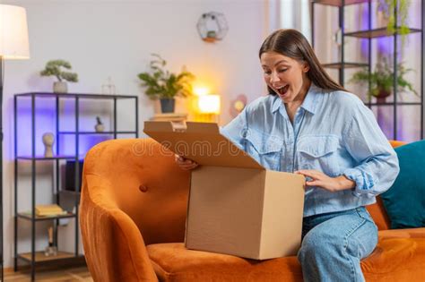 Happy Woman Shopper Unpacking Cardboard Box Delivery Parcel Online Happy Woman Shopper Unpacking Cardboard Box Delivery Parcel Online