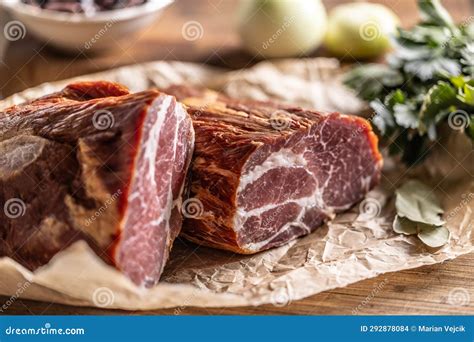 Smoked Pork Neck Cut Into Two Parts Ready For Heat Treatment Stock Smoked Pork Neck Cut Into Two Parts Ready For Heat Treatment Stock