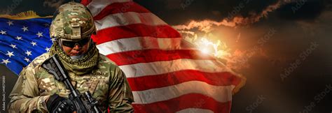 Us Army Soldier In Combat Uniforms Holding Machine Gun On The National Us Flag With Gold Sunlight Background In Banner Size Veterans Day Patriot Concept And Independence Day Id4 Stock Photo