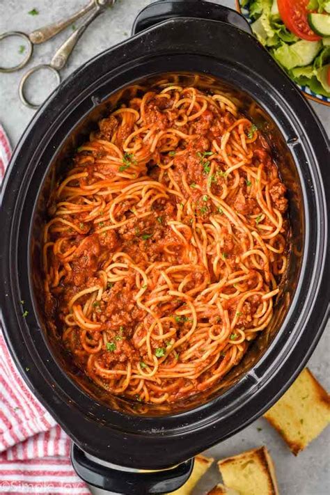 Woman In Digital Delicious Slow Cooker Spaghetti Recipe Using